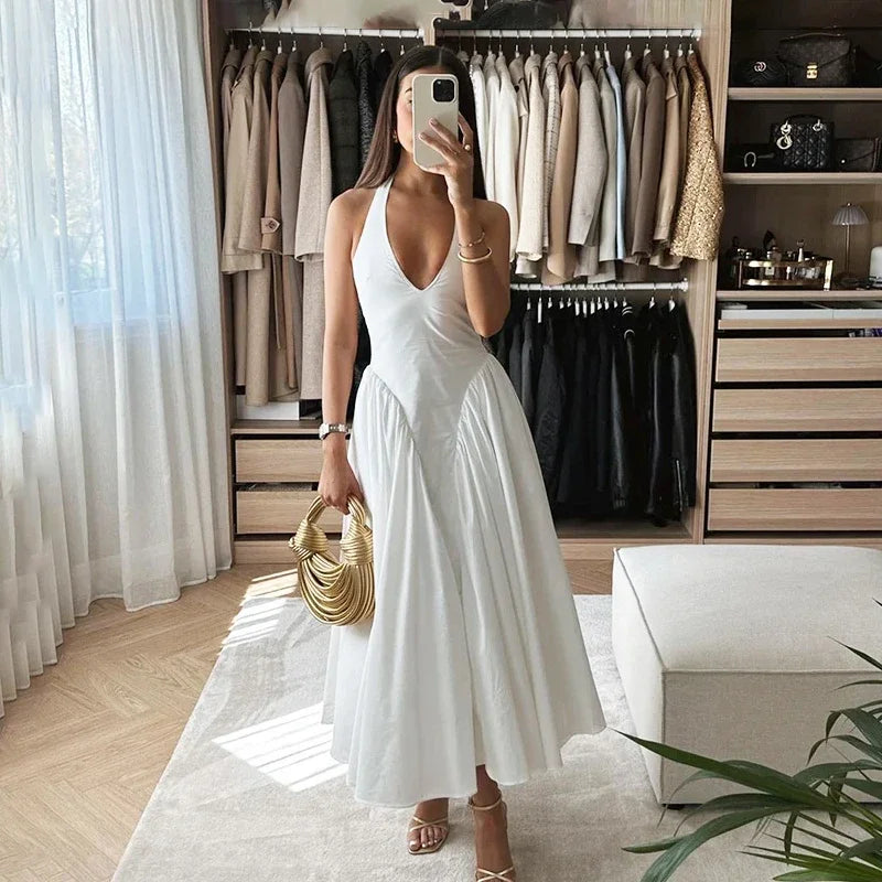 TARUXY Sexy Deep V Hollow Halterneck Large Hem Dress For Women Solid High Waisted Backless Splice Summer New Vacation Long Dress voguable